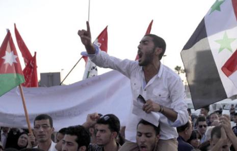 خلال تظاهرة في عمان رفضاً للتدخل في سوريا (أ ف ب) 