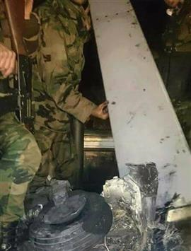 قطعة من طائرة الاستطلاع الاميركية التي أسقطت قرب اللاذقية أمس